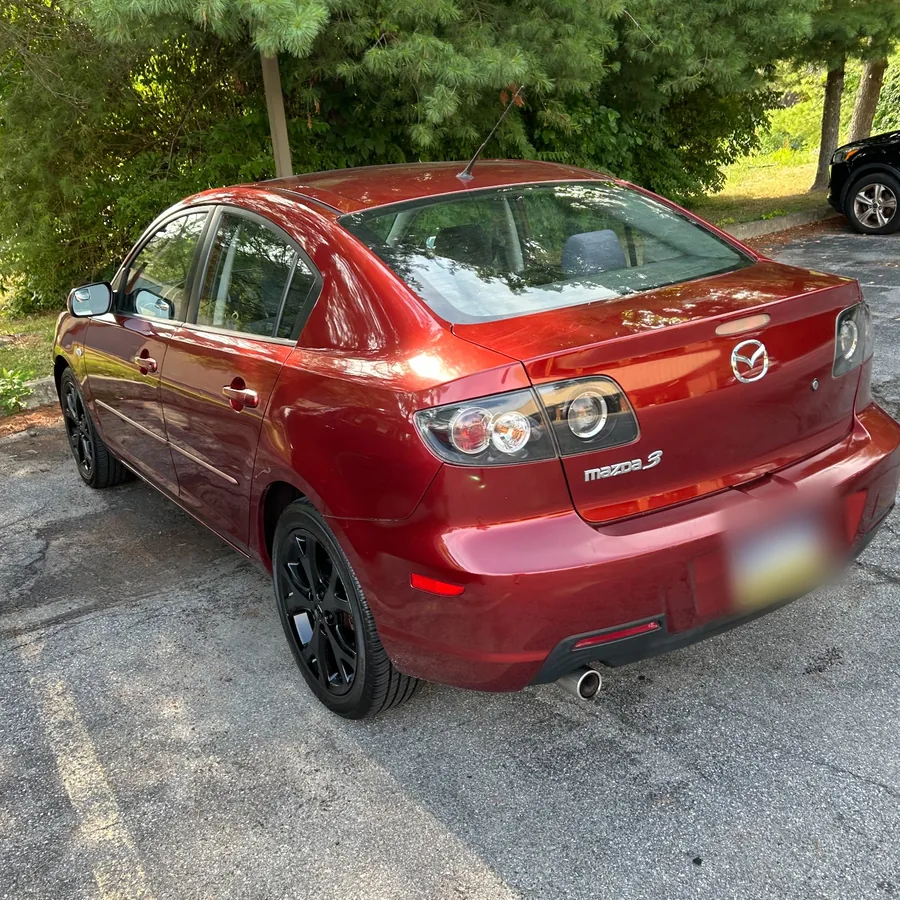 Matt's red Mazda3, the inexpensive car he drove while saving for his Subaru BRZ